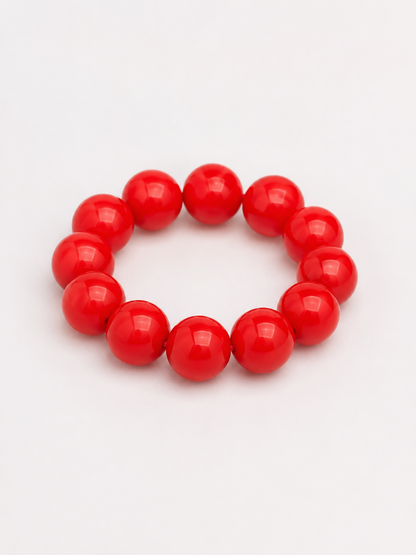 A beaded stretch bracelet made of glossy, round red beads. Uga, georgia football, university of Georgia game day jewelry. 
