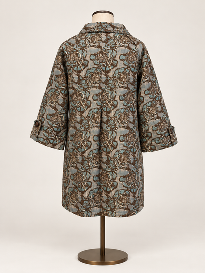 Taupe &amp; Teal Brocade Jacket a short-sleeved button-front coat with an intricate brown, beige, and gray paisley pattern.