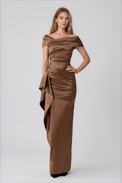 A woman modeling a floor-length off-the-shoulder gown in a warm brown satin fabric by Teri Jon Stretch Taffeta Asymmetrical Off The Shoulder Side Ruffle Gown ITEM 267008BRZ-0