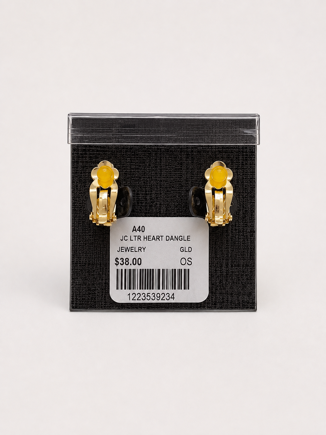 Textured Gold Heart and Crystal Drop Clip-on Earrings pair of gold heart-shaped stud earrings with clear round rhinestones