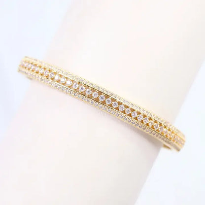 Gold bracelet with clear stones