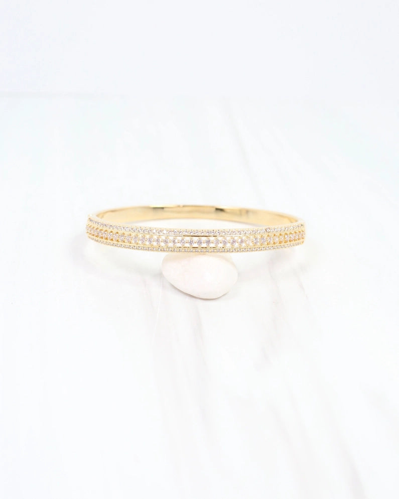 Gold bracelet with lined in cz