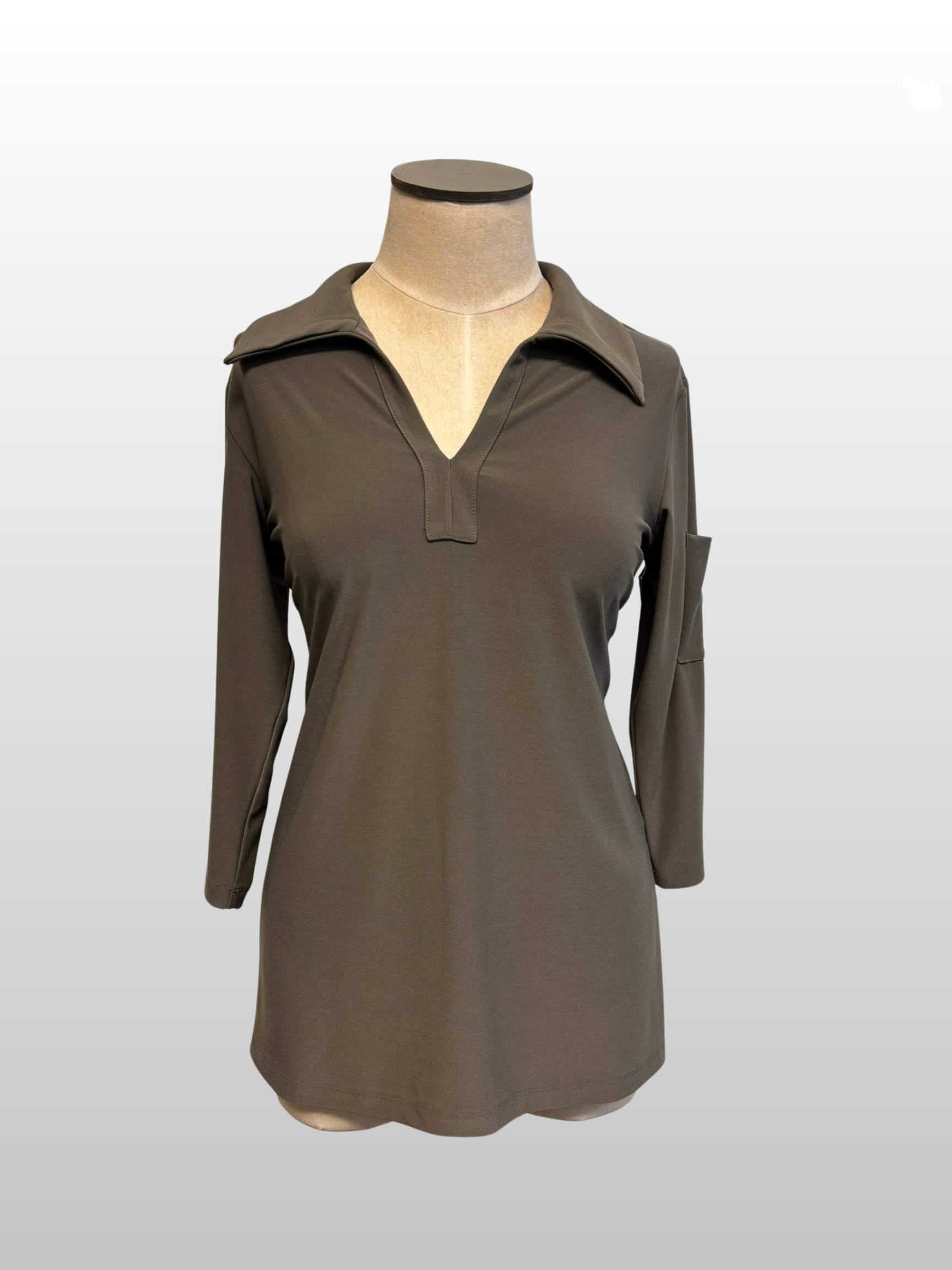 Brown long-sleeve shirt on a mannequin against a white background