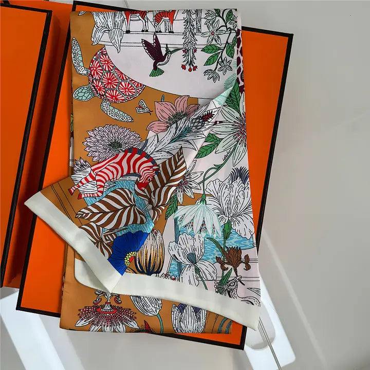 Colorful fabric with animal and floral patterns on an orange background