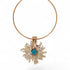 Gold necklace with a floral pendant featuring a blue gemstone on a white background