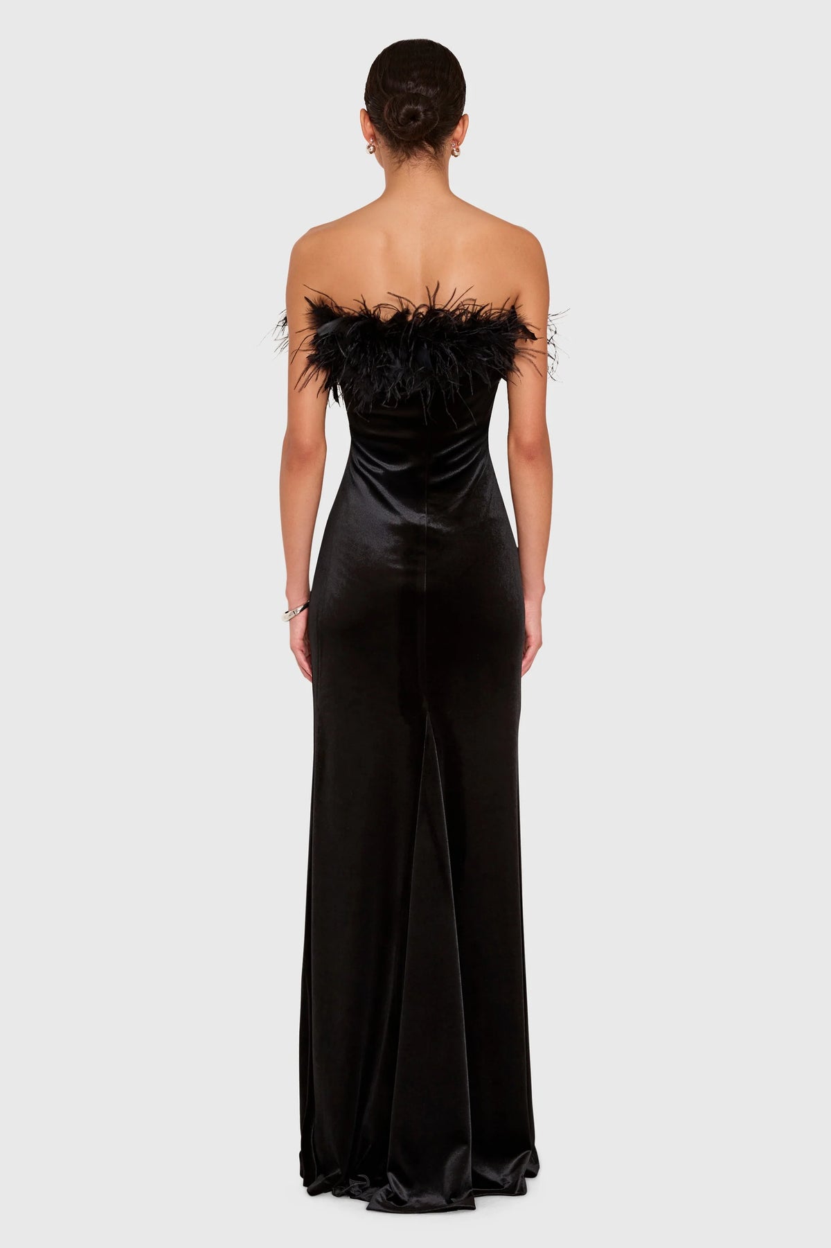 The Amanda Uprichard Ella Gown in black, a rich plush velvet. Strapless and finished with an ostrich feather trim at the neckline. Style No. VE-23164