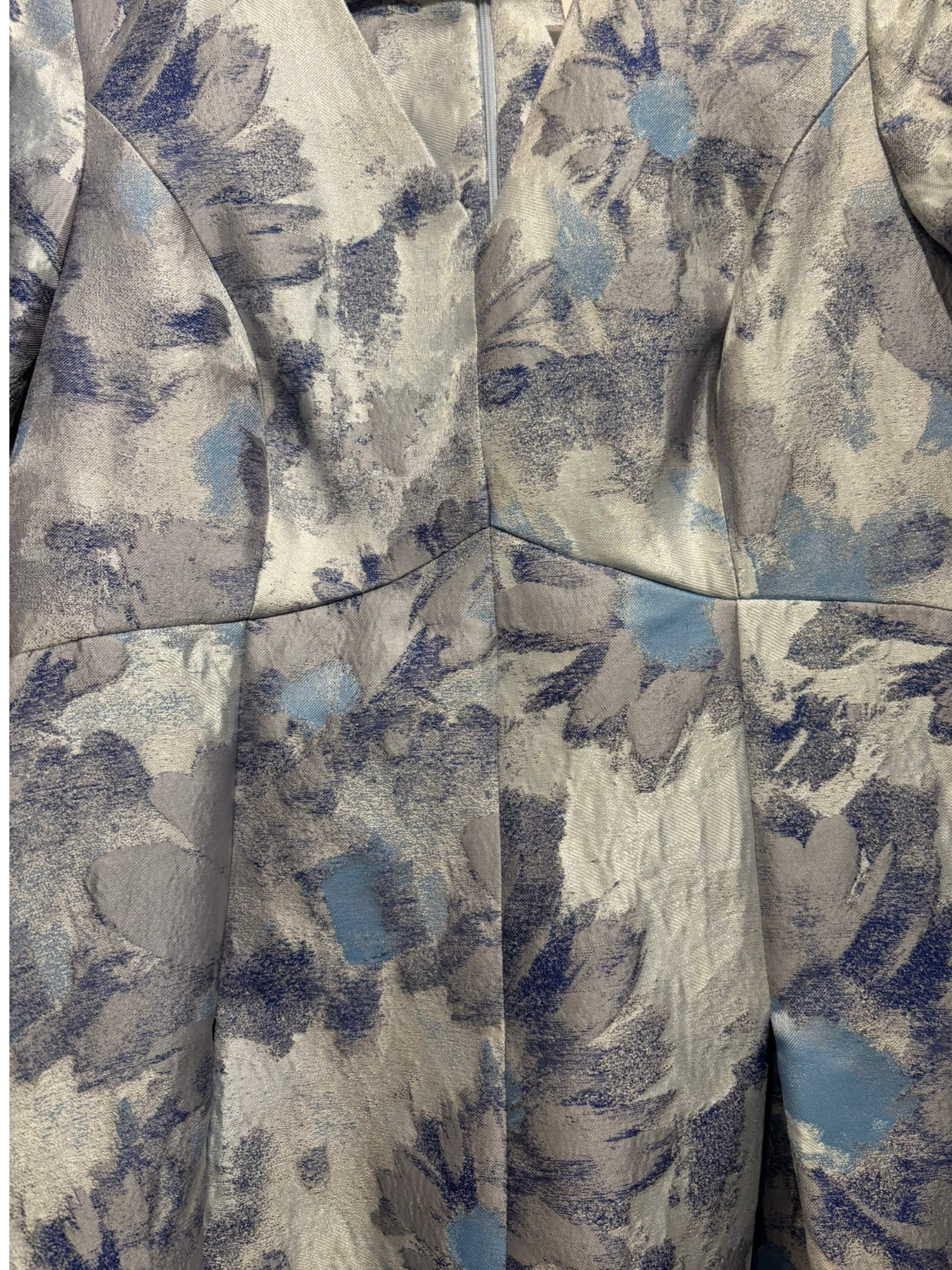 Close-up of a patterned fabric with blue and gray colors.