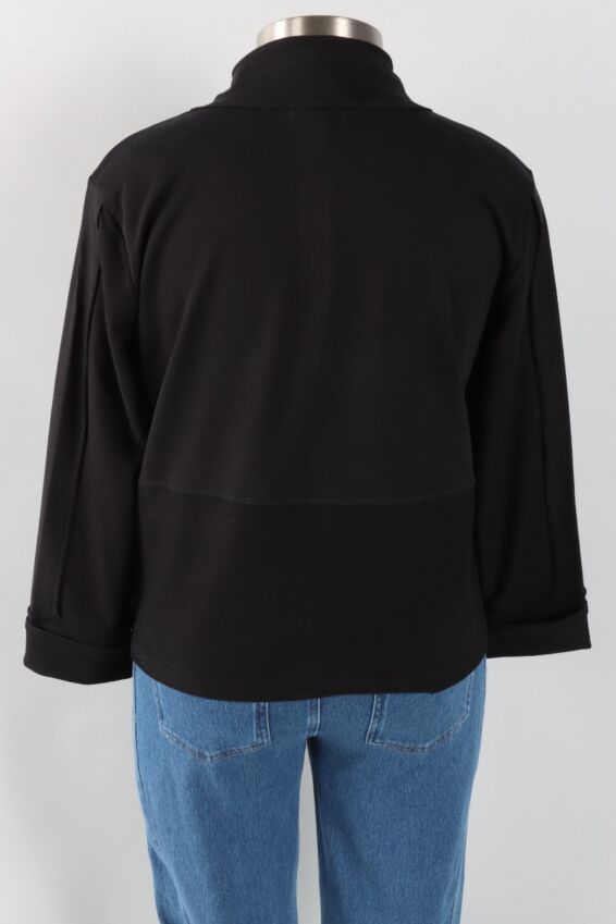 Black jacket on a mannequin with a white background