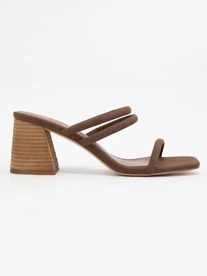 Brown sandal with a block heel on a white background