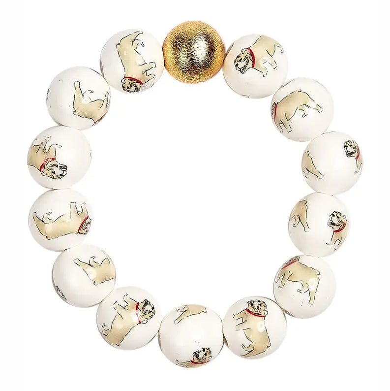 bulldog Georgia Beaded Bracelet  beaded stretch bracelet featuring white round beads printed with illustrations of bulldogs, accented by one metallic gold bead at the top.