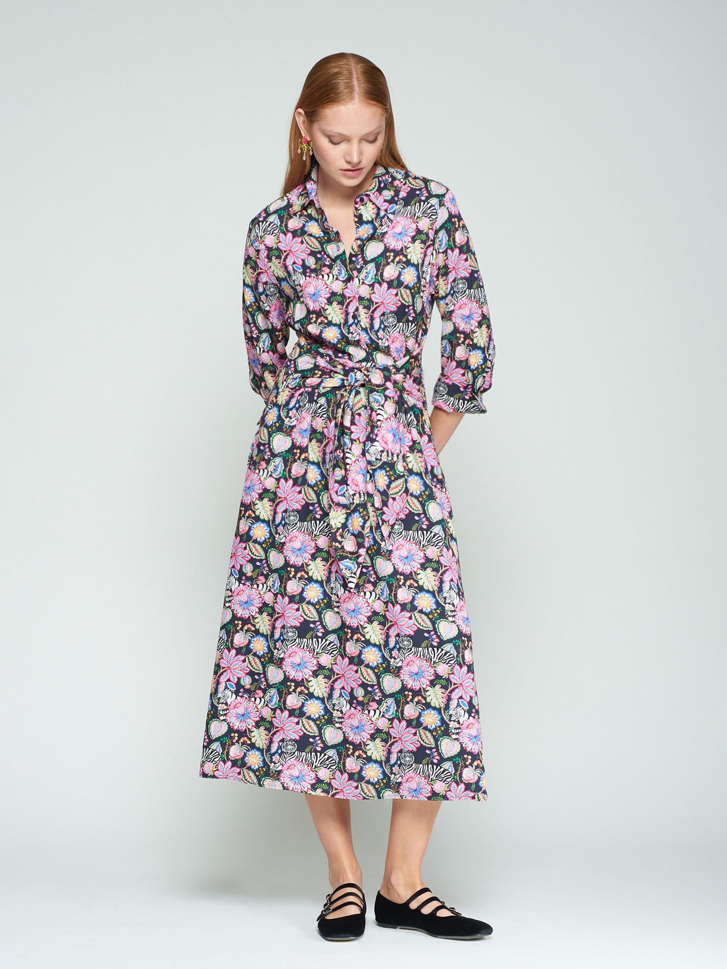 Woman wearing a floral dress on a white background