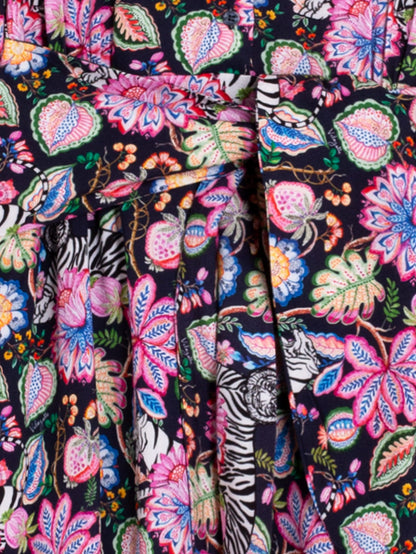 Close-up of a colorful floral and tiger pattern fabric.