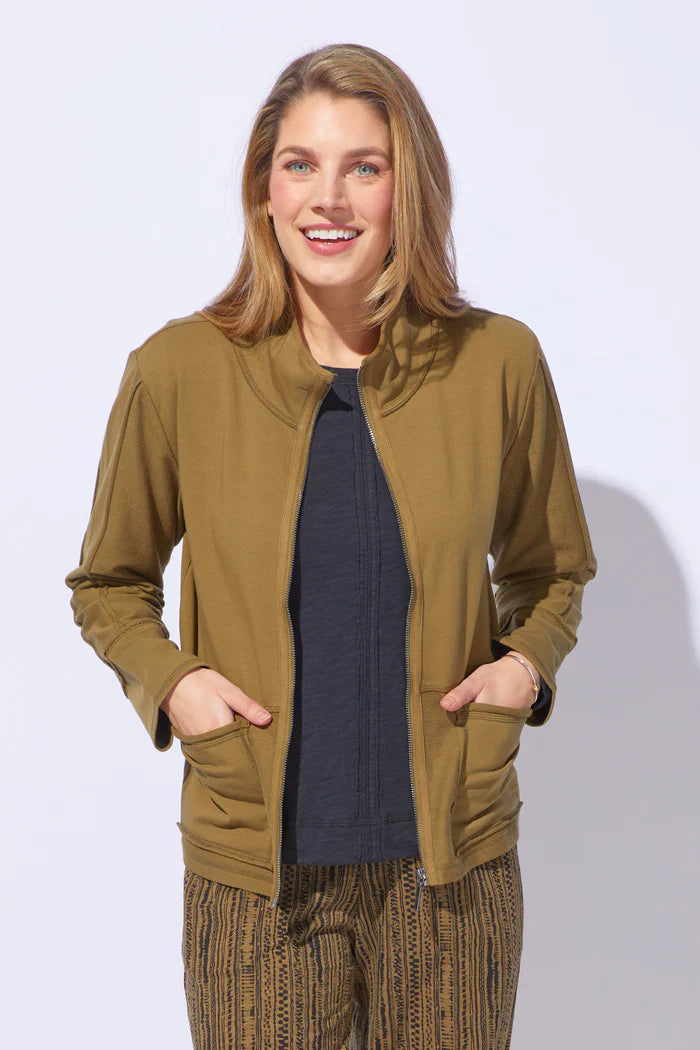Woman wearing a green jacket on a white background to show the jackets features, actual jacket in black.