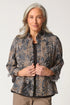 Woman wearing a patterned jacket on a white background