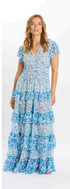 Woman wearing a blue floral dress on a white background
