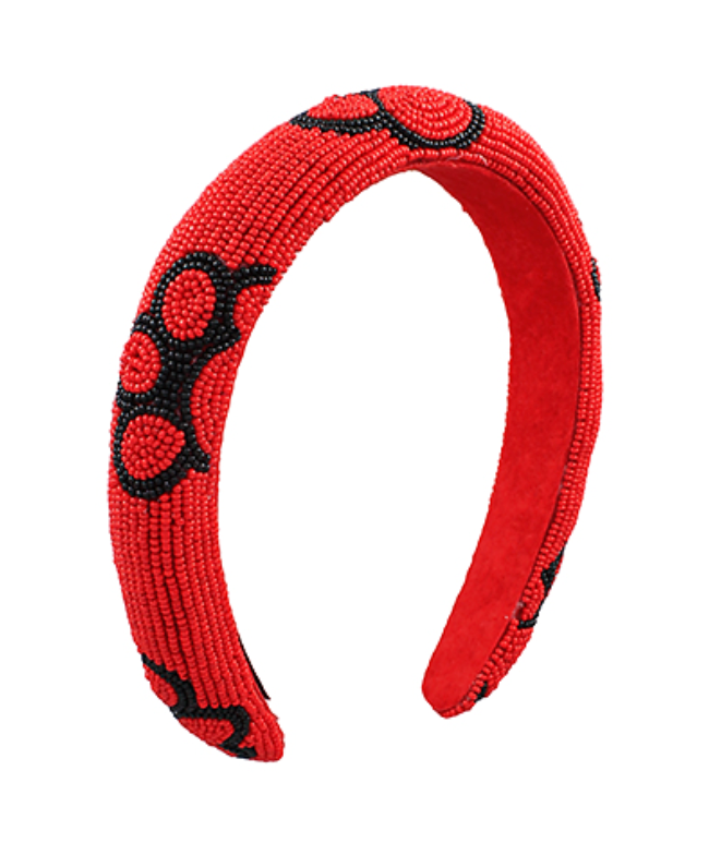 Red headband with black paw patterns on a white background