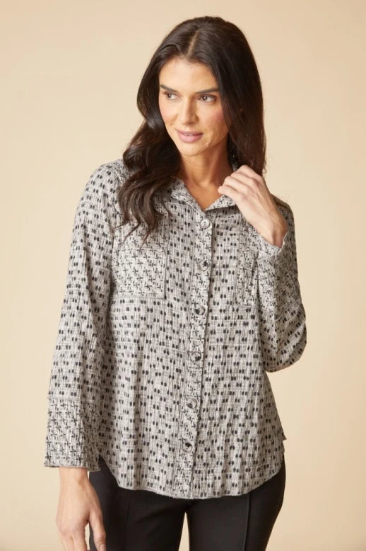 Woman wearing a patterned blouse Mix and Match Geo Seamed Tunic