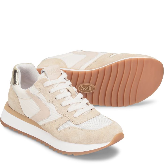 Beige and white sneaker with brown sole on a white background
