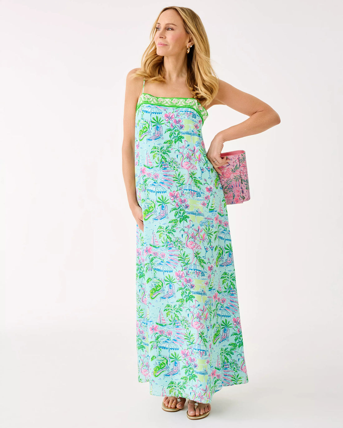 Woman wearing a colorful floral dress on a white background