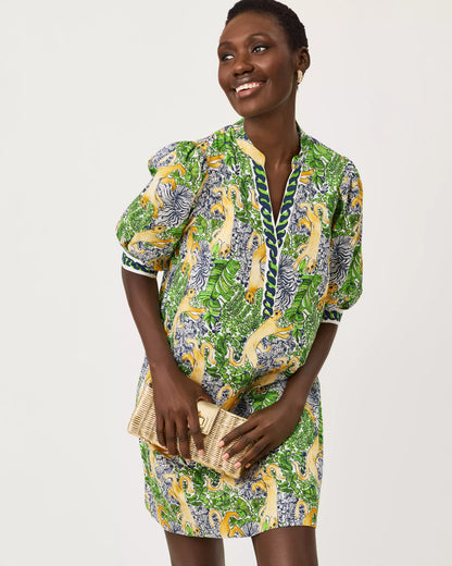 A woman modeling a short-sleeved mini dress with a vibrant green, yellow, and blue floral print lilly pulitzer mialeigh dress Color: Multi Lil Palm Prowl Engineered Woven Dress