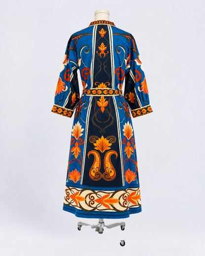 Maude Vivante blue and orange floral print cotton midi dress with three-quarter sleeves, V-neckline, and matching tie waist
