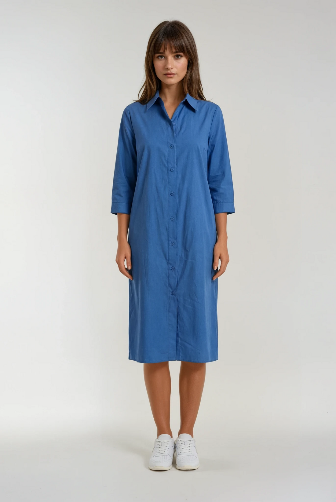 Woman wearing a blue dress on a white background