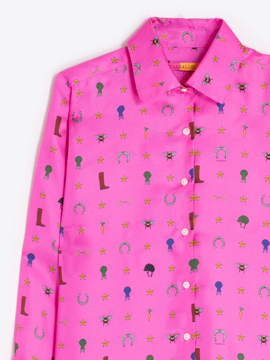 Pink shirt with colorful equestrian pattern on a white background