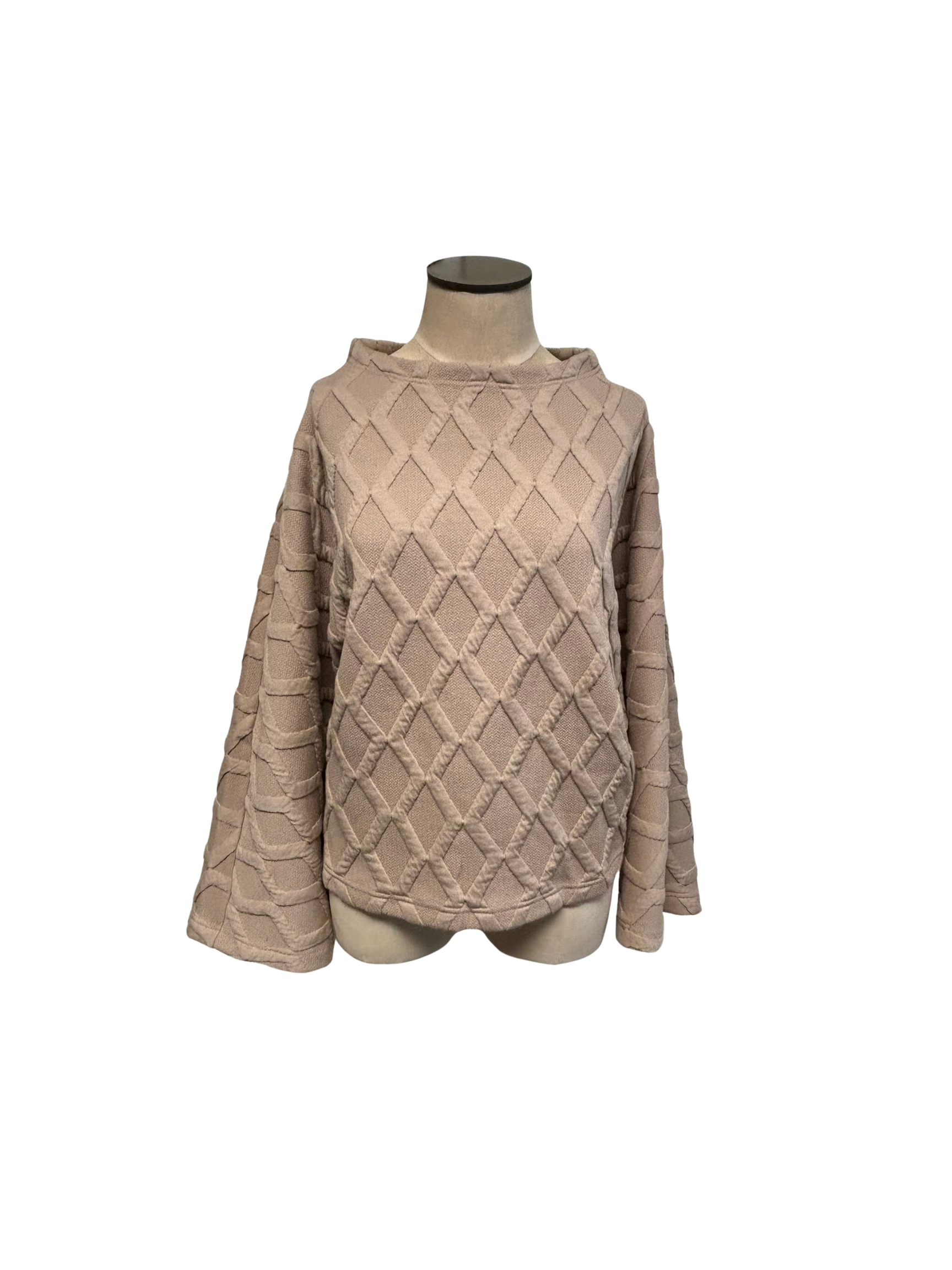 Beige quilted sweater on a mannequin against a white background