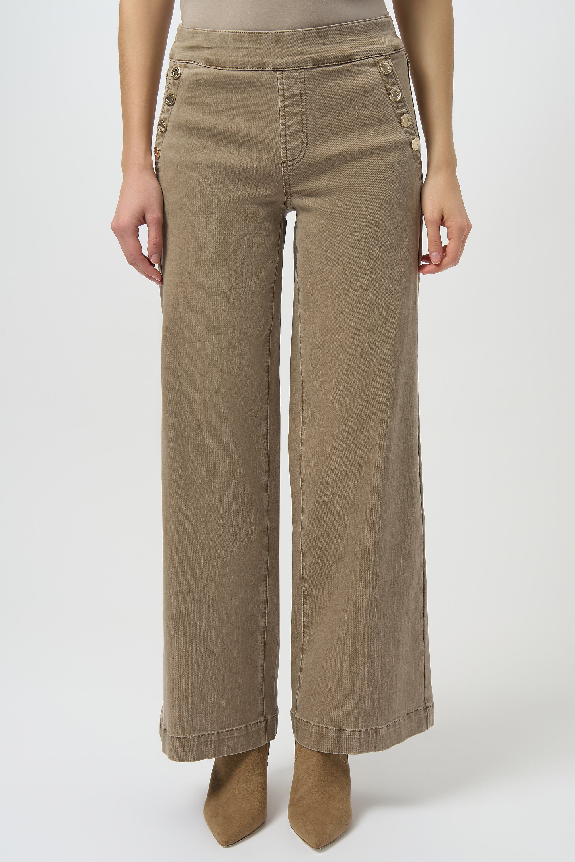 Beige wide-leg pants worn by a person on a white background