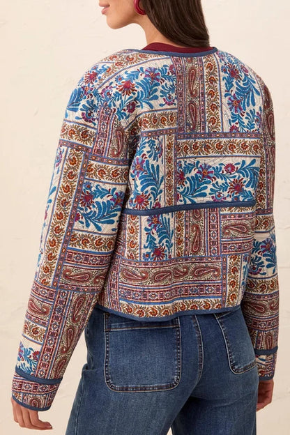 tribal Sharp Reversible Quilt Jacket quilted jacket with a vibrant multicolor paisley and floral pattern in blue, red, and gold.