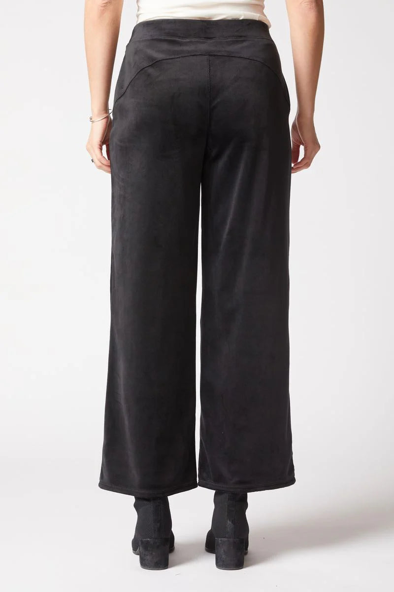 Black wide-leg pants worn by a person on a white background